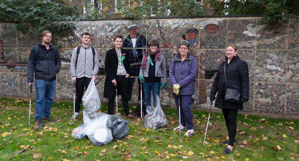 Litter picking volunteers pose with bin bags